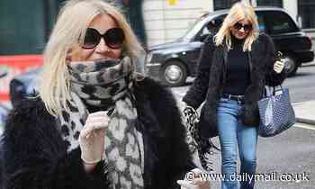 Michelle Collins played it safe as she was spotted leaving the BBC studios in surgical gloves