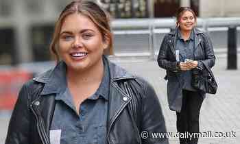 Scarlett Moffatt cuts a casual figure in a biker jacket and over-sized denim shirt