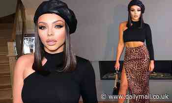 Jesy Nelson flashes her very taut abs in a one shoulder black crop top and leopard print skirt