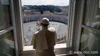 Pope Francis gives his blessing to an eerily empty St. Peter's Square
