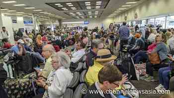 Chaos at US airports as medical screenings jam up returning Americans - CNA