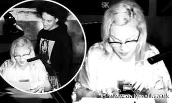 Madonna takes to her typewriter as she and toy boy Ahlamalik Williams hunker down in Paris