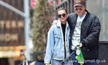 Emily Ratajkowski and husband Sebastian Bear-McClard walk their dog