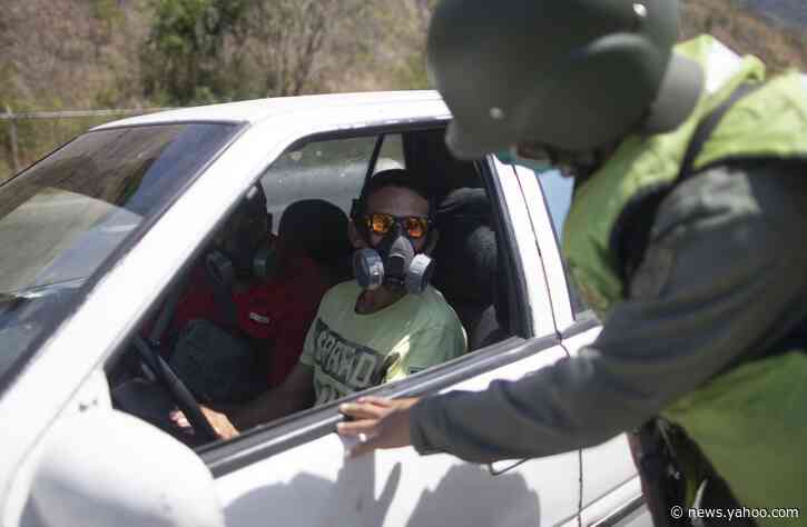 Economic fallout from virus felt in gas lines in Venezuela