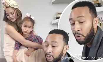 Chrissy Teigen wears a towel as she tells John Legend to play the song 'he broke up with me to'