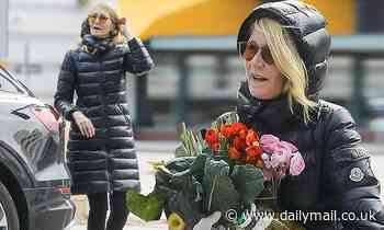 Laura Dern wears latex gloves to shop for flowers and goodies at farmers market amid the coronavirus