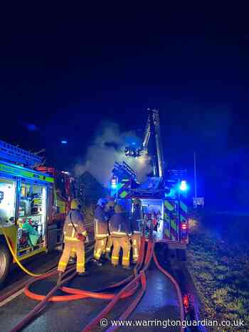 Main road shut both ways following building fire in Higher Whitley