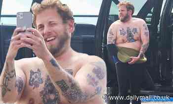 Jonah Hill pulls down his wetsuit  in Malibu to show off his bare chest