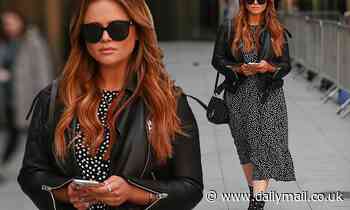 Emily Atack is chic in a monochrome dress and leather jacket amid the coranovirus pandemic