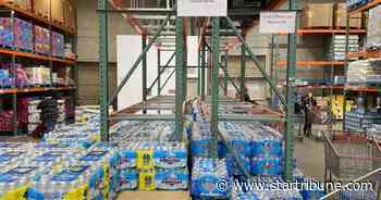 'Crazy' mass buying of bottled water lead to limits, shortages