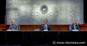 As Congress debates who gets a check, some experts say: Make it universal