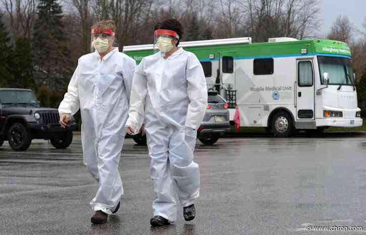 Lockdowns multiply globally as virus strains health systems