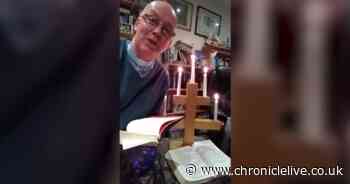 Watch vicar accidentally set himself on fire during virtual church service
