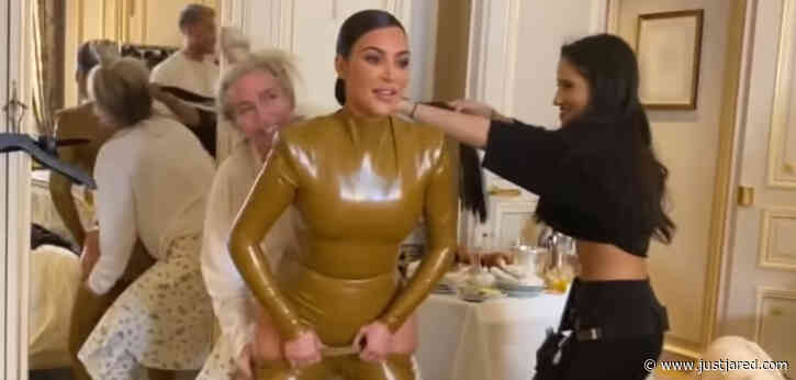 Kim Kardashian Struggles to Squeeze Into Skin-Tight Latex Outfit During Paris Fashion Week - Watch!
