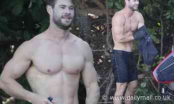 Chris Hemsworth displays his biceps and abs during surfing trip in Byron Bay - Daily Mail
