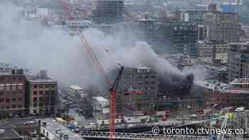 Explosions reported at scene of fire at abandoned building downtown