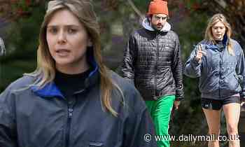 Elizabeth Olsen puts on a leggy display in black shorts as she takes a stroll
