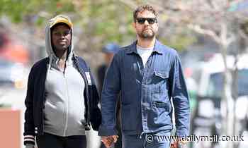 Joshua Jackson and Jodie Turner-Smith hold hands on casual stroll