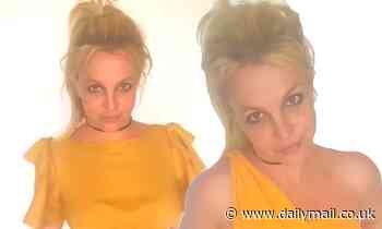 Britney Spears dons yellow and insists she was JOKING when claiming to beat Usain Bolt's 100 meter