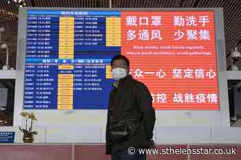 China bars most foreigners to curb imported virus cases - St Helens Star