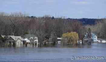 Regions brace to fight rising flood waters and cases of COVID-19