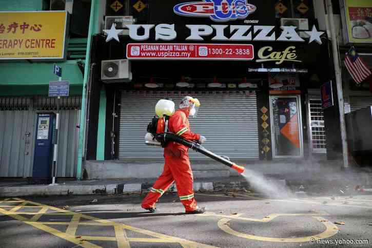 Malaysia arrests hundreds for flouting curbs on movement as virus deaths rise