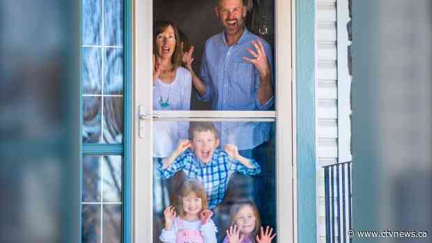 Calgary photographer captures life during COVID-19 one 'porch portrait' at a time