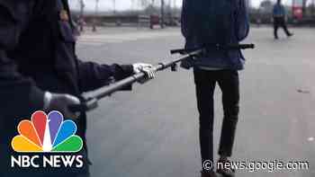 Police In Nepal Use Special Device To Keep Safe Distances During Coronavirus Lockdown | NBC News - NBC News