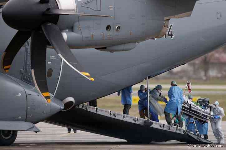 France moves patients from swamped hospitals as death toll climbs