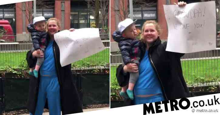 Amy Schumer and baby son take sign to dad’s nursing home amid coronavirus lockdown