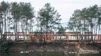DnA_Design and Architecture build riverside visitor centre around trees - Dezeen