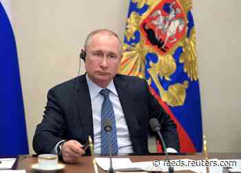 Putin takes coronavirus precautions as Moscow unveils tracking app