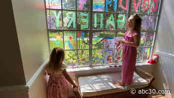 Girls create window art for neighborhood to lift spirits during COVID-19 outbreak