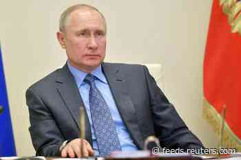 Putin takes coronavirus precautions as Moscow unveils tracking app