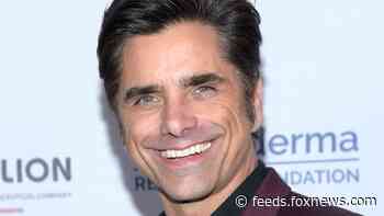 John Stamos reveals he took home the 'Full House' love seat, co-stars react