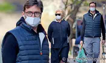 Hugh Jackman and wife Deborra-Lee don masks while out shopping and walking their dogs in New York