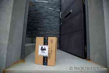 Exclusive: Amazon to deploy masks and temperature checks for workers by next week