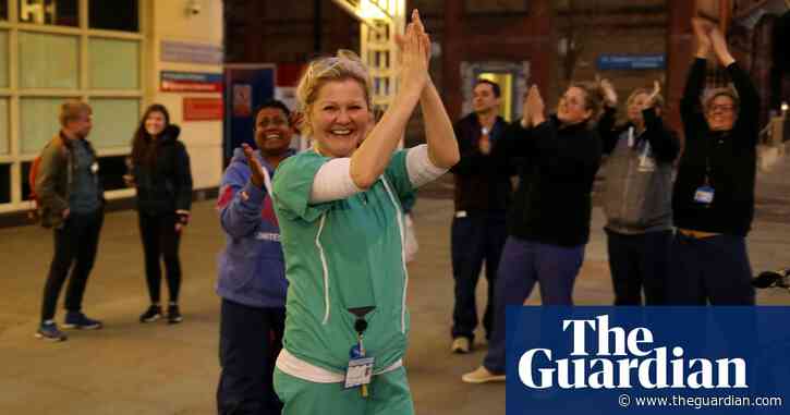 Pots, pans, cheers and bagpipes: UK applauds key workers in coronavirus fight – video