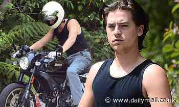 Cole Sprouse shows off guns in black tank top as he takes motorcycle out during quarantine break