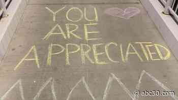 Chalk messages encourage CRMC workers on their way into work