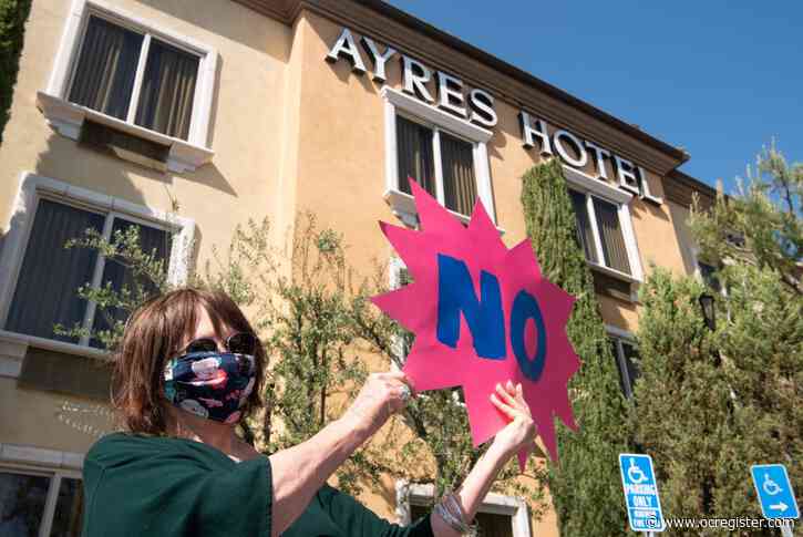 Senior residents protest hotel planned for homeless coronavirus patients, operator says it will be isolated and locked down