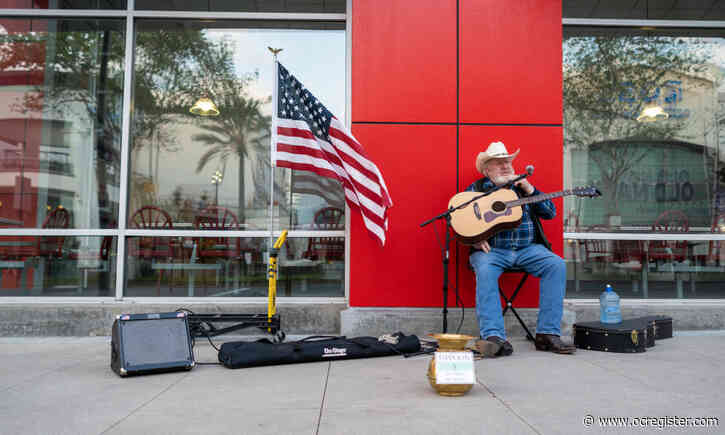 Though people, and tips, are scarce, street musician carries on amid coronavirus-emptied streets