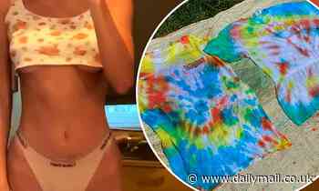Kendall Jenner flaunts impressive abs and a hint of underboob, while tie-dying clothes at home