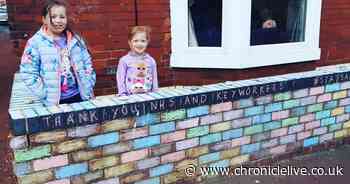Sunderland family spreading cheer through a vibrant rainbow wall