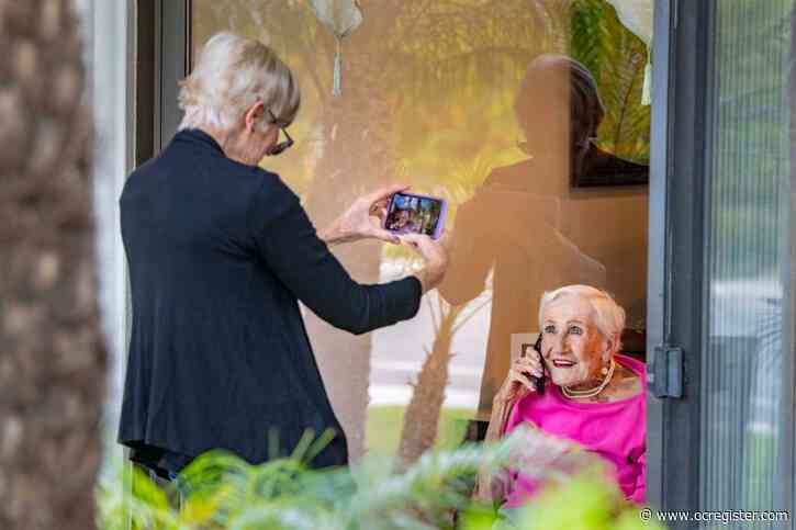 Video calls replace hugs for elderly in senior care amid coronavirus outbreak
