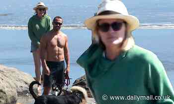 Robin Wright dons Daisy Dukes on beach stroll with shirtless husband Clement Giraudet and dog