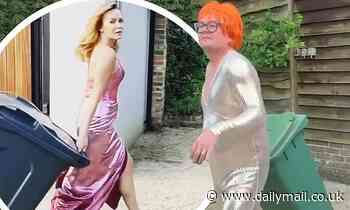 Alan Carr takes out his bin in a sparkling silver jumpsuit and orange wig