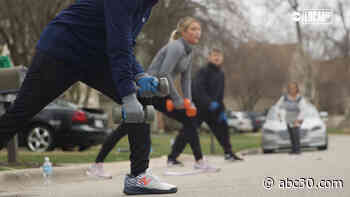 One street is coming together for daily workouts, while physical distancing