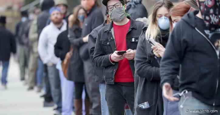Wisconsin voters wait for hours, others stay home amid virus