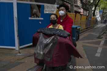 Virus-hit Wuhan cautiously revives amid thicket of controls